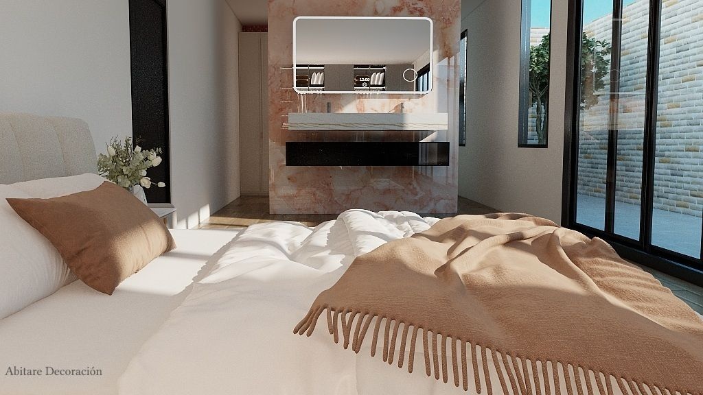 Dormitorio principal con iluminaci&oacute;n natural desde patio interior